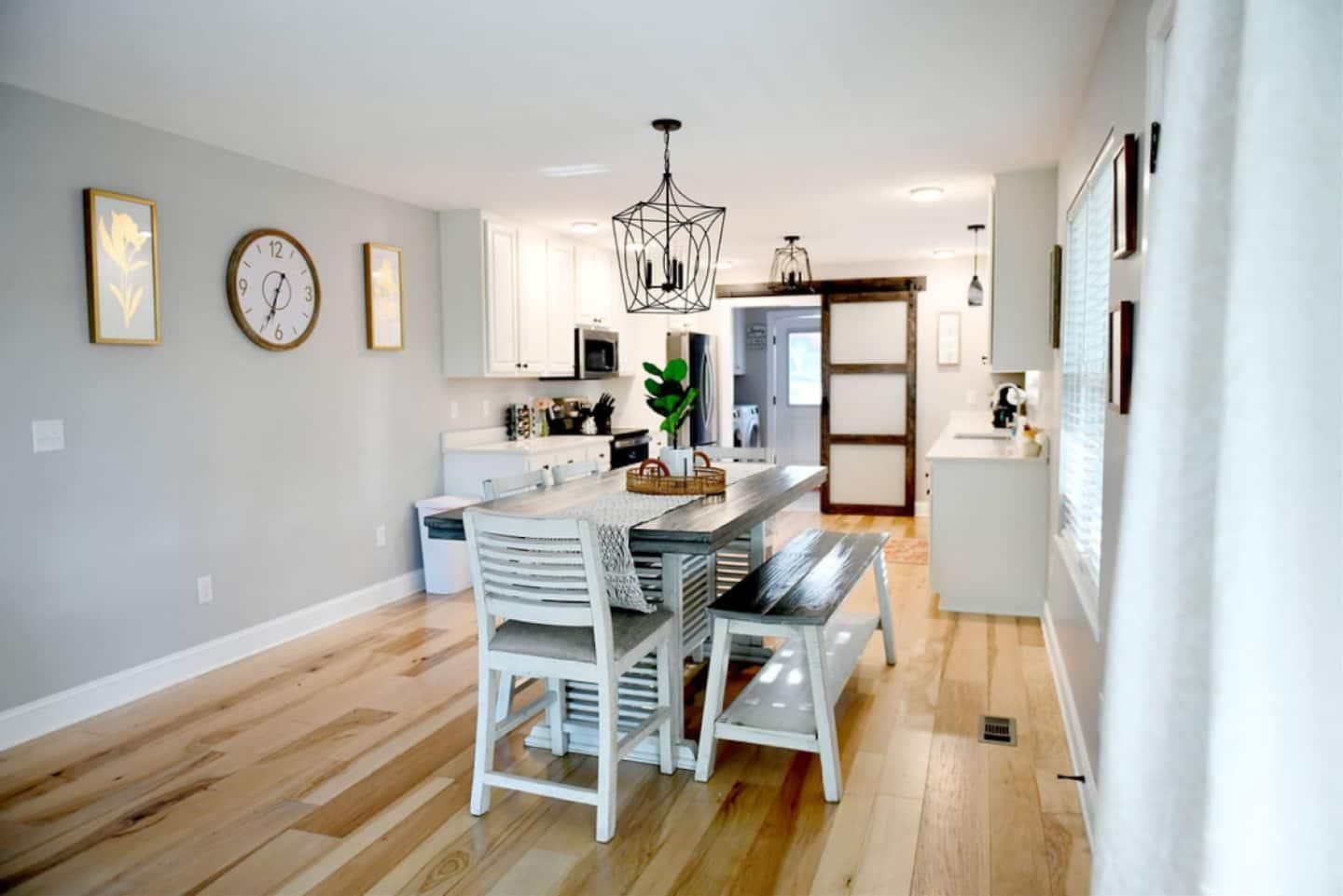 Farmhouse dining table with bench seating, the kitchen beyond